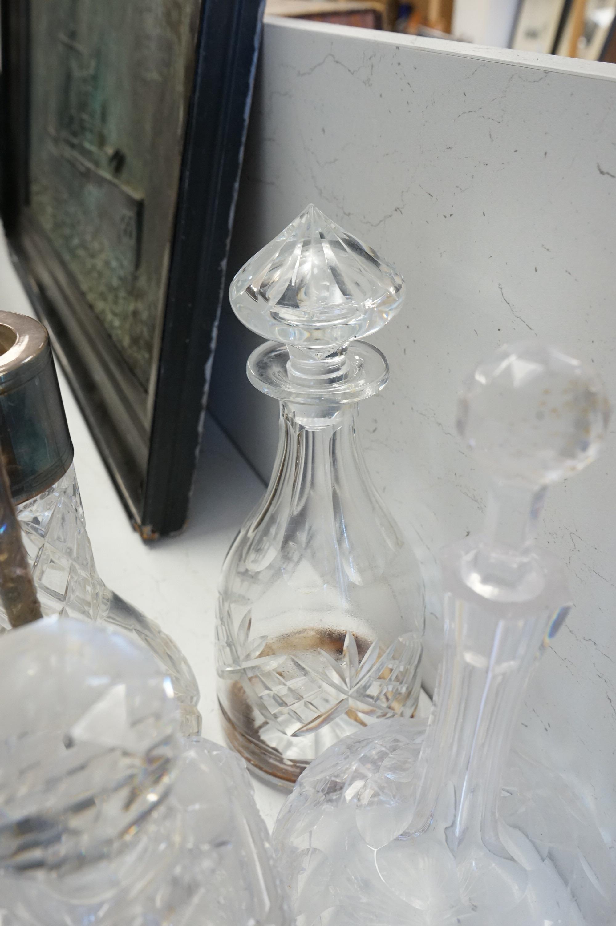 A collection of various cut glass to include decanters and a small pedestal bowl, largest 30cm high